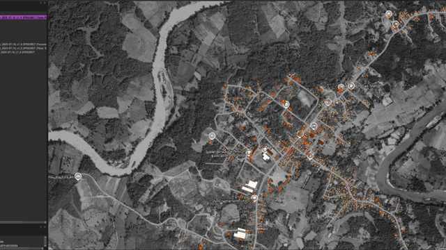 Building-level population allocation in a Laos QGIS workspace